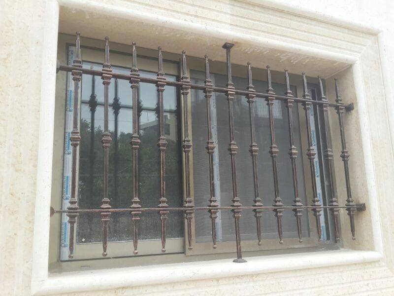 Exterior metal window guard, fence, and railing work, selected view 1